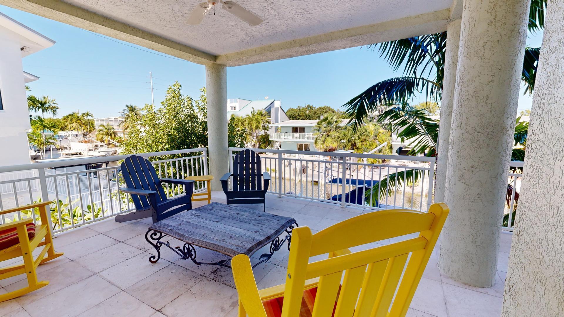 131 Coco Plum Road South Key Largo, FL 33037 - Photo 19 of 19 a view of a chairs and table in the balcony