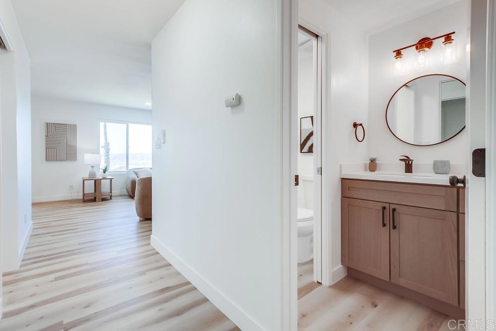 3606 Vista Rey, Unit 37 Oceanside, CA 92057 - Photo 26 of 45 a en suite bathroom with a toilet a sink and a mirror