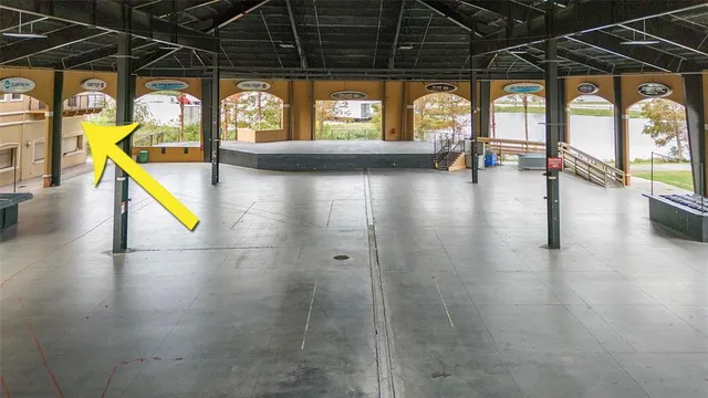 a view of a indoor swimming pool with a table and chairs