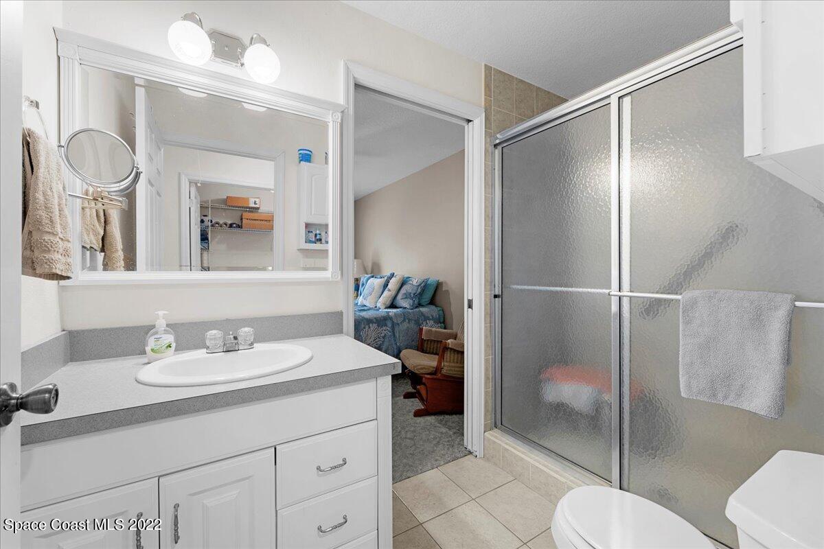 3205 Westland Melbourne, FL 32934 - Photo 30 of 55 a bathroom with a sink and a mirror