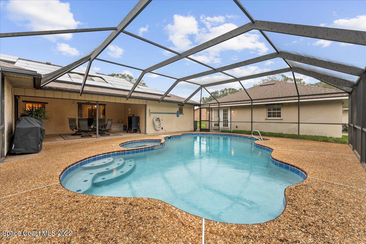 3205 Westland Melbourne, FL 32934 - Photo 33 of 55 a view of a swimming pool with a patio