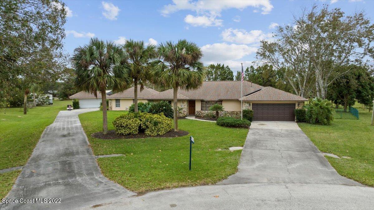 3205 Westland Melbourne, FL 32934 - Photo 42 of 55 a front view of a house with yard