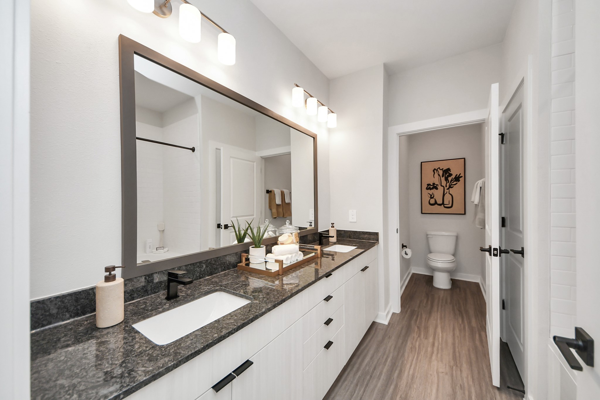 7711 Longmire Road, Unit 2 Conroe, TX 77304 - Photo 13 of 48 Primary Suite offers walk-closet,bath w/dual vanities&lux tub/shower.