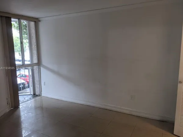 a view of an empty room and window