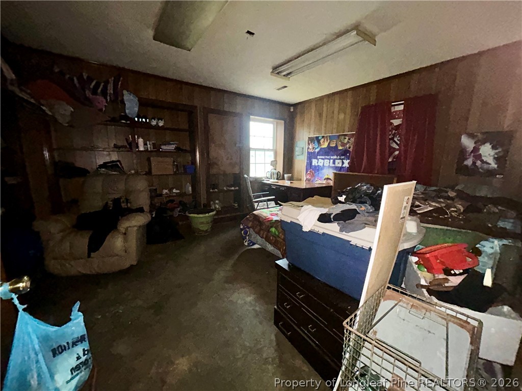918 Opal Road Red Springs, NC 28377 - Photo 5 of 26 a living room with furniture a gym equipment and a large window