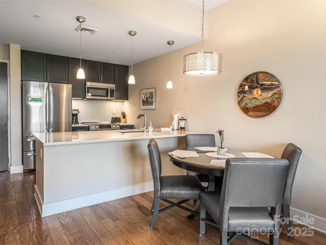 a kitchen with a table and chairs in it