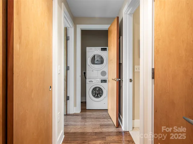 a view of a door and chair door with wooden floor