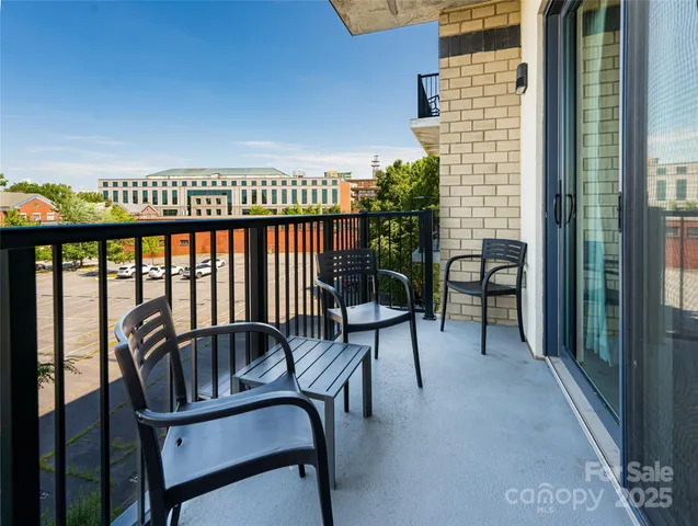 a view of a balcony with chairs