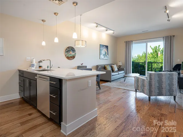 a living room with a couch and a large window
