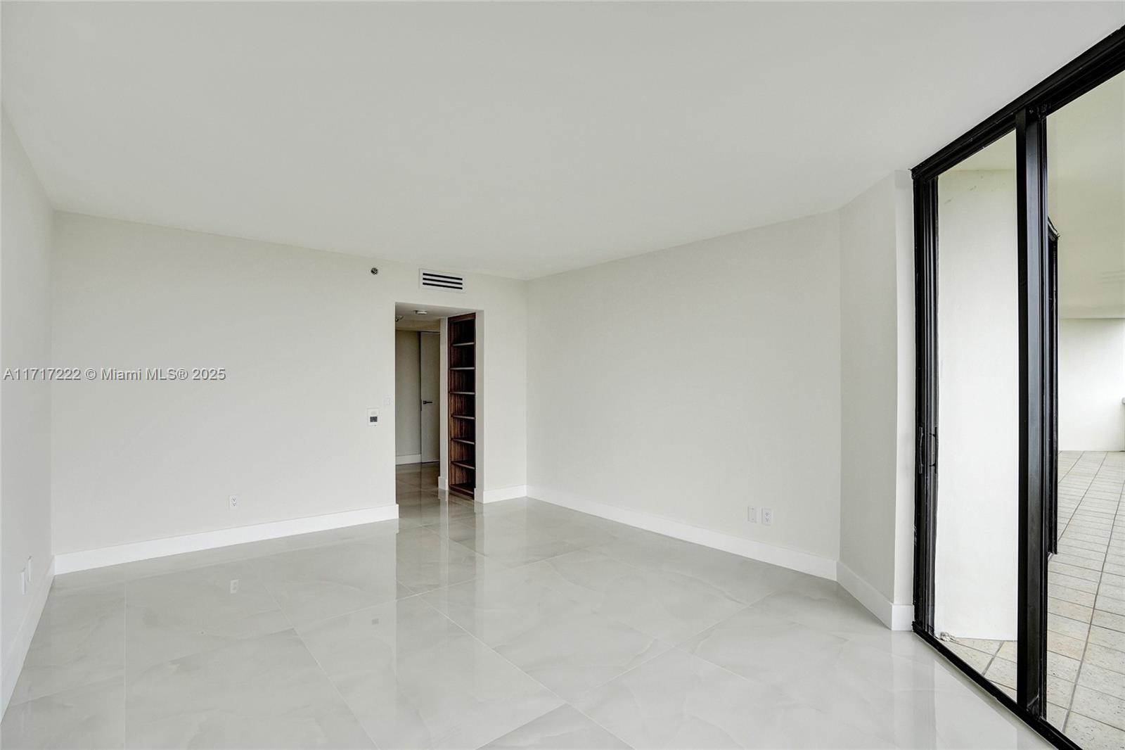 2000 Island Boulevard, Unit 608 Aventura, FL 33160 - Photo 12 of 38 a view of an empty room with wooden floor
