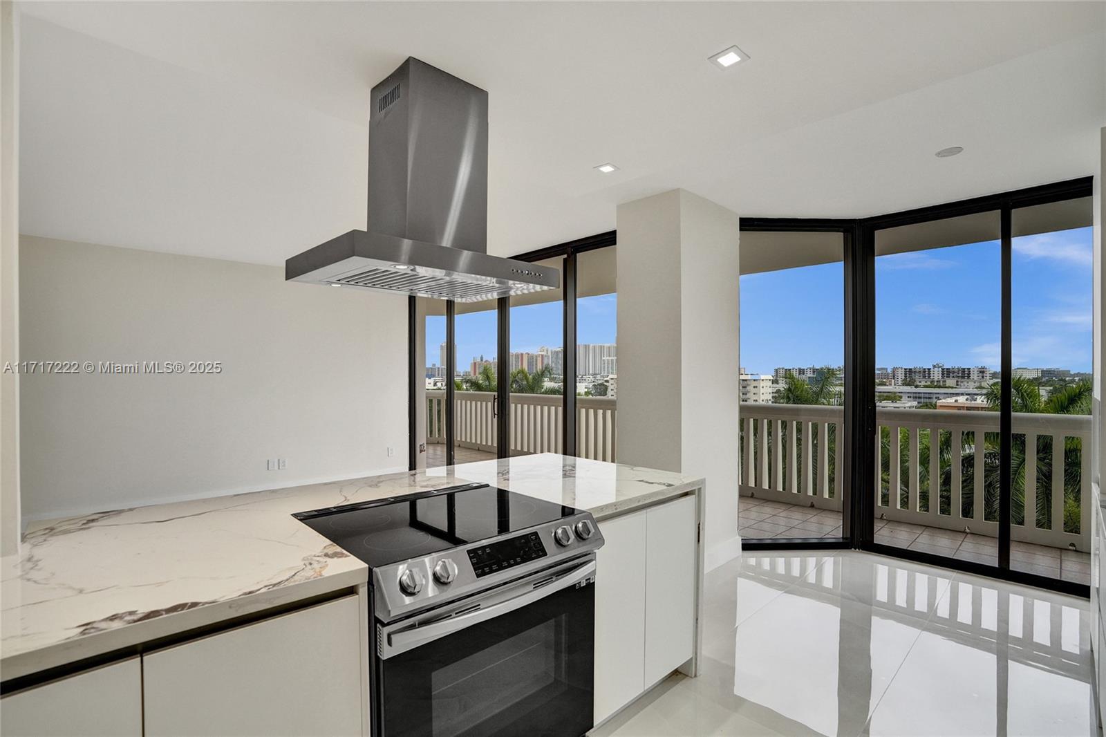 2000 Island Boulevard, Unit 608 Aventura, FL 33160 - Photo 7 of 38 a kitchen with a stove and a sink