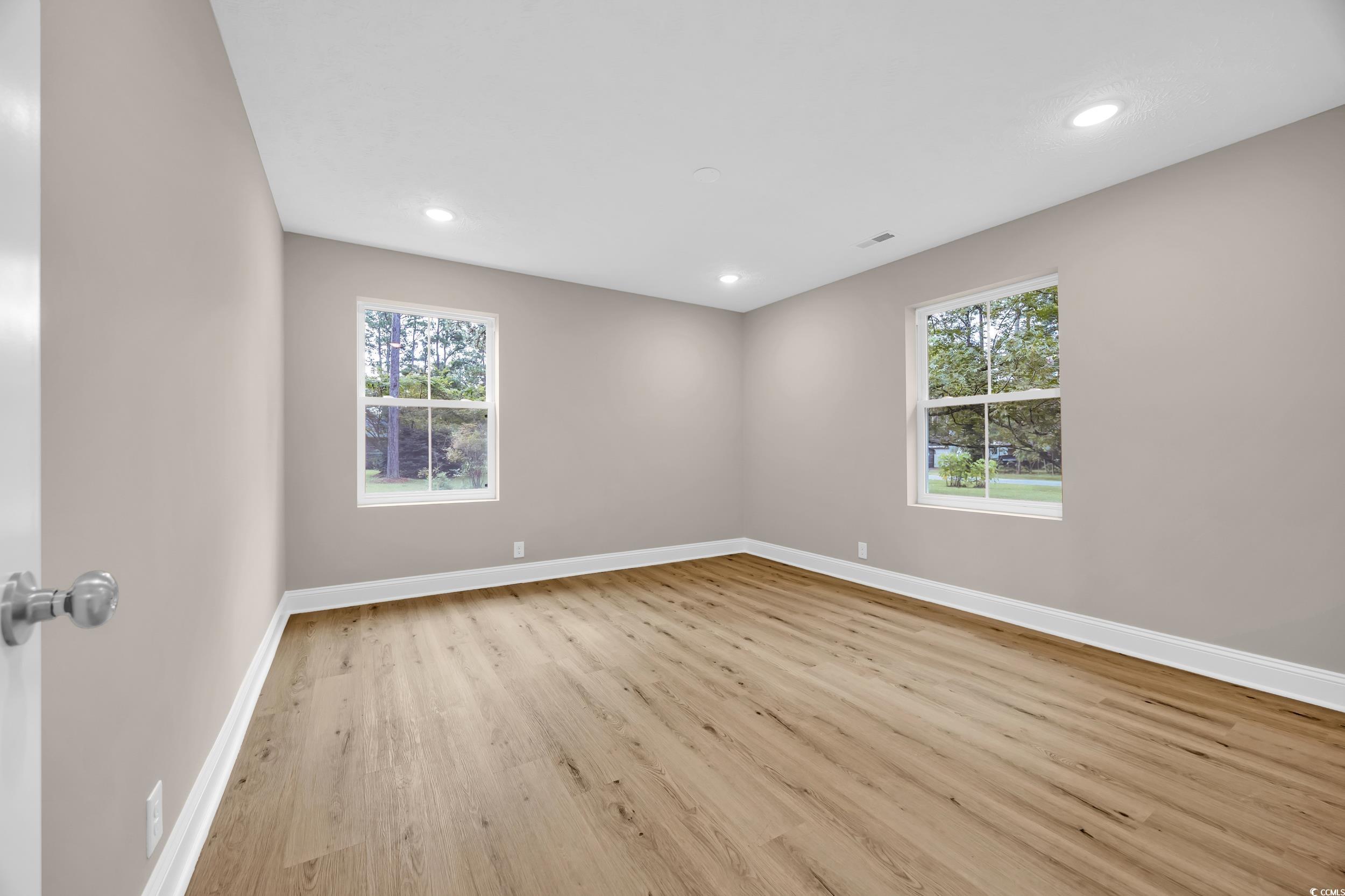 970 Virginia Drive Loris, SC 29569 - Photo 14 of 28 Empty room featuring light wood-type flooring and recessed lighting