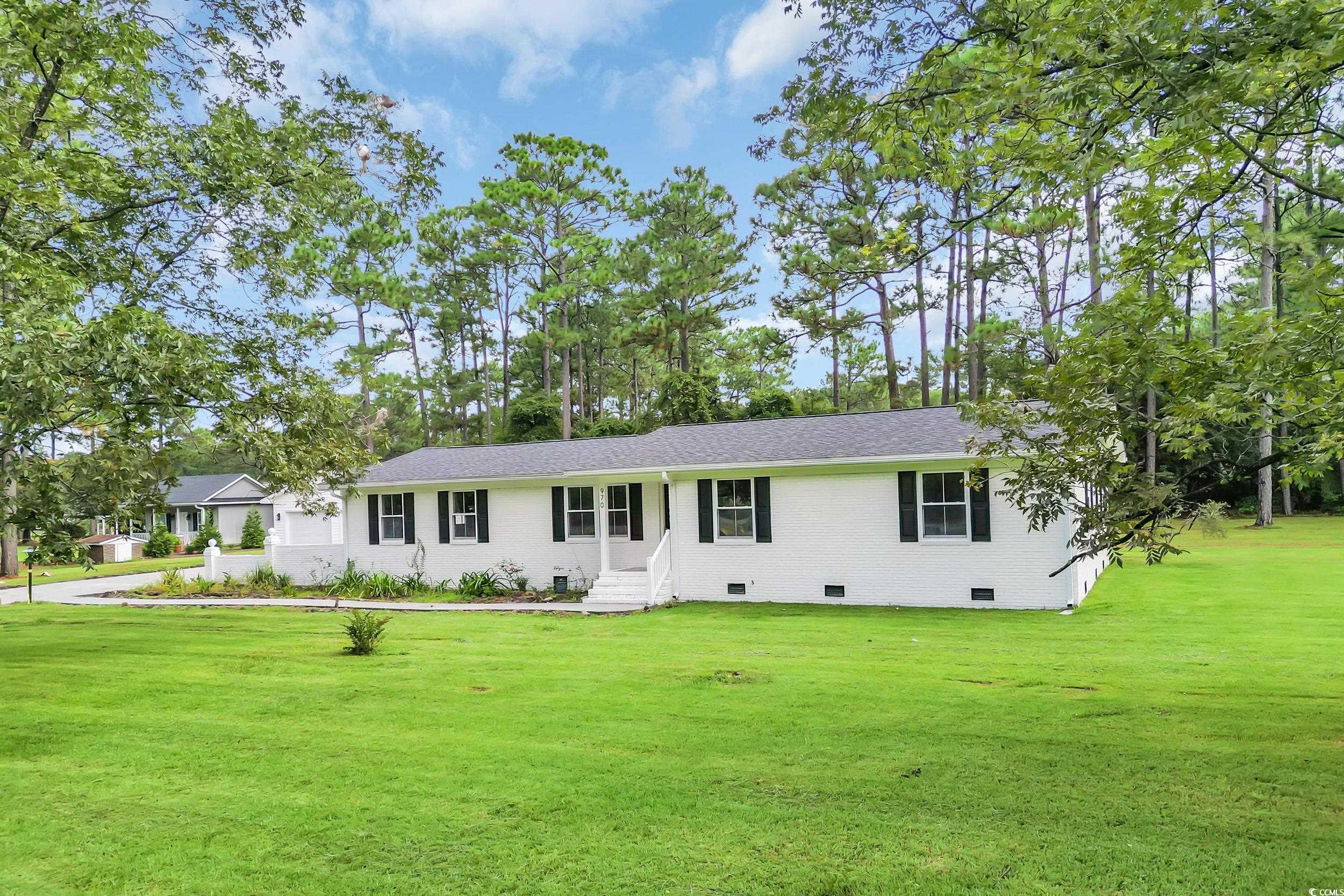 970 Virginia Drive Loris, SC 29569 - Photo 2 of 28 Ranch-style home with crawl space, a front yard, brick siding, and a shingled roof