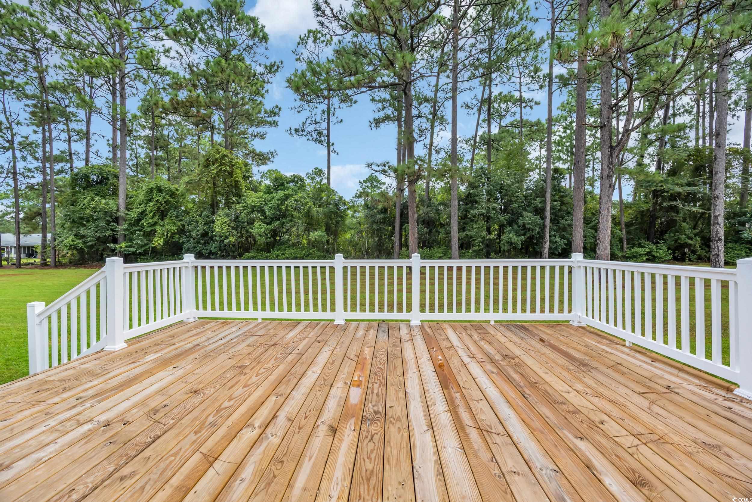 970 Virginia Drive Loris, SC 29569 - Photo 20 of 28 Wooden terrace featuring a lawn