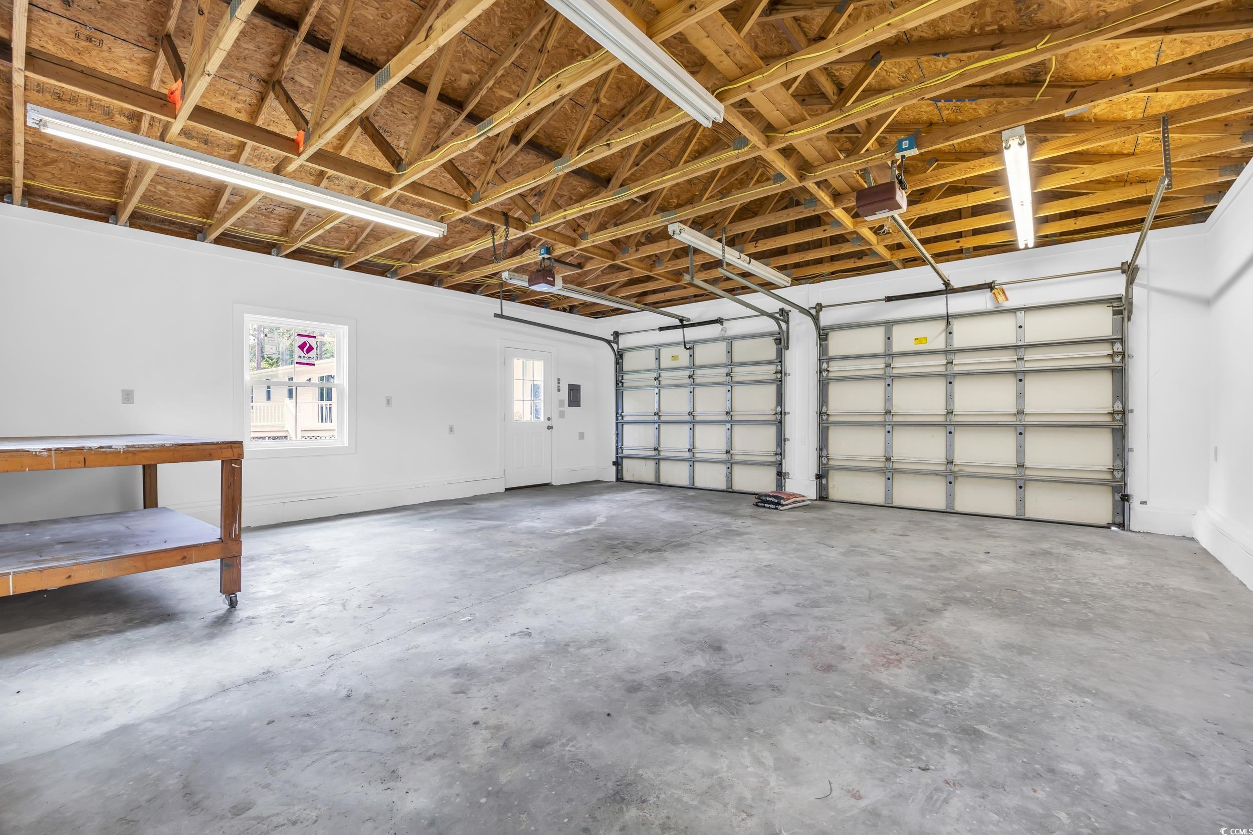 970 Virginia Drive Loris, SC 29569 - Photo 24 of 28 Garage with a garage door opener