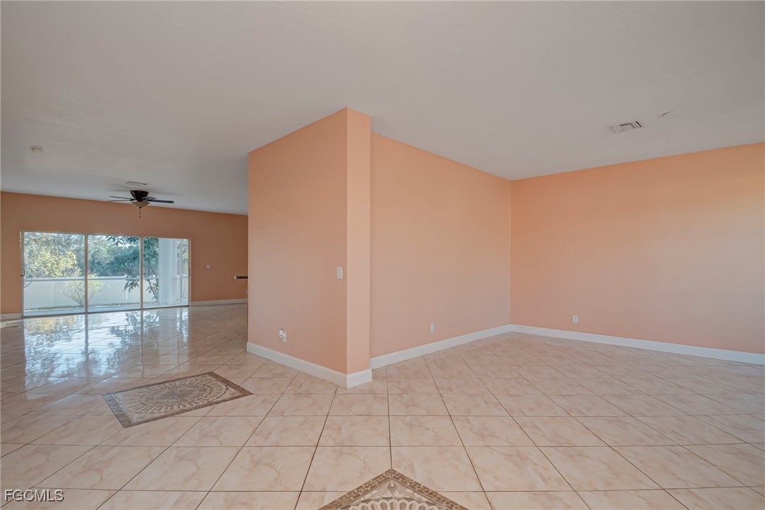 3605 17th Street West Lehigh Acres, FL 33971 - Photo 2 of 27 an empty room with windows and entrance
