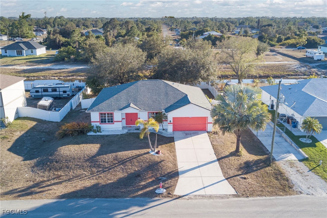 3605 17th Street West Lehigh Acres, FL 33971 - Photo 26 of 27 aerial view of a house with a yard