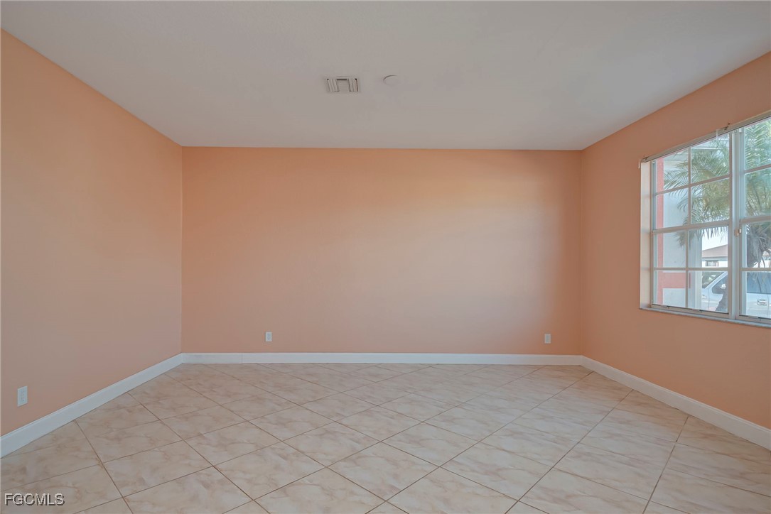 3605 17th Street West Lehigh Acres, FL 33971 - Photo 3 of 27 an empty room with windows