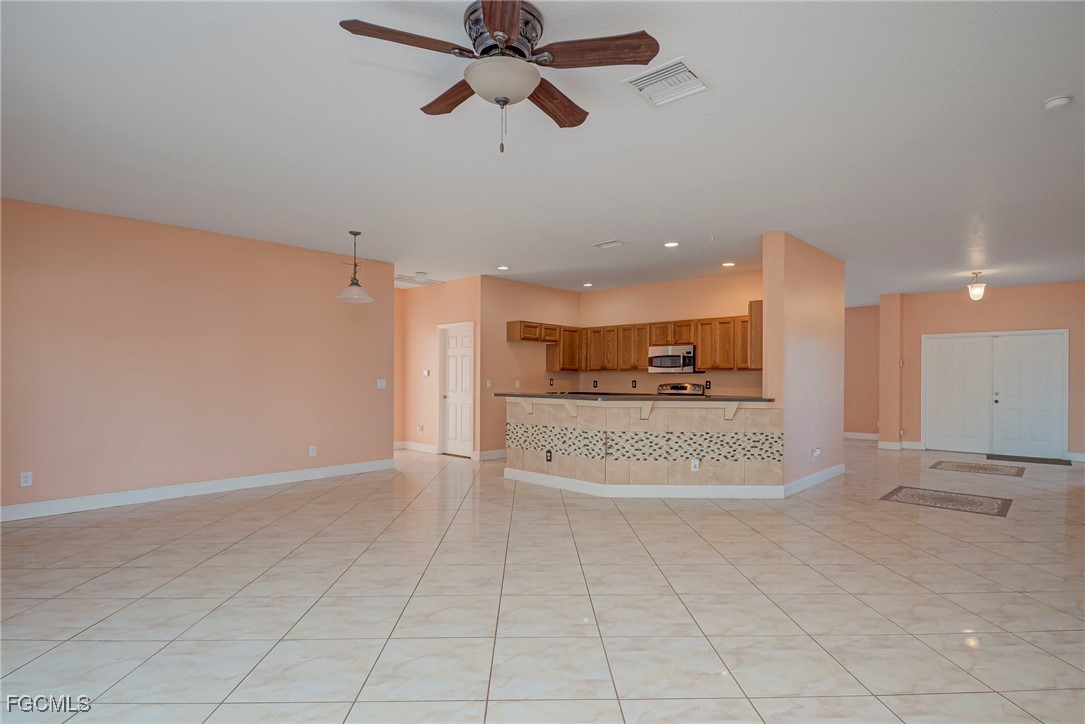 3605 17th Street West Lehigh Acres, FL 33971 - Photo 8 of 27 a view of a kitchen with a sink and a window