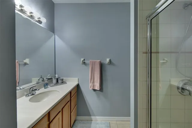 a bathroom with a double vanity sink and mirror