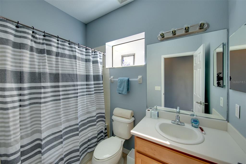 4026 Overture Circle Bradenton, FL 34209 - Photo 13 of 26 a bathroom with a sink toilet and shower