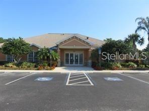 4026 Overture Circle Bradenton, FL 34209 - Photo 18 of 26 a front view of a house with a yard