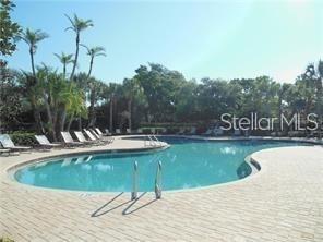 4026 Overture Circle Bradenton, FL 34209 - Photo 19 of 26 a view of swimming pool with a yard