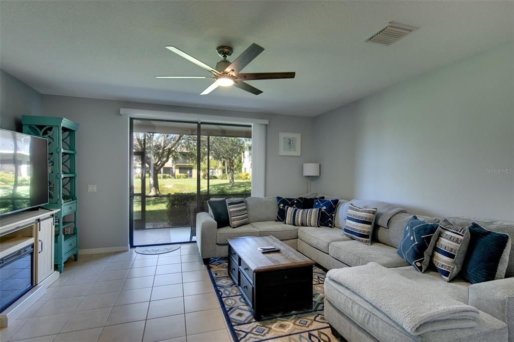4026 Overture Circle Bradenton, FL 34209 - Photo 6 of 26 a living room with furniture and a flat screen tv