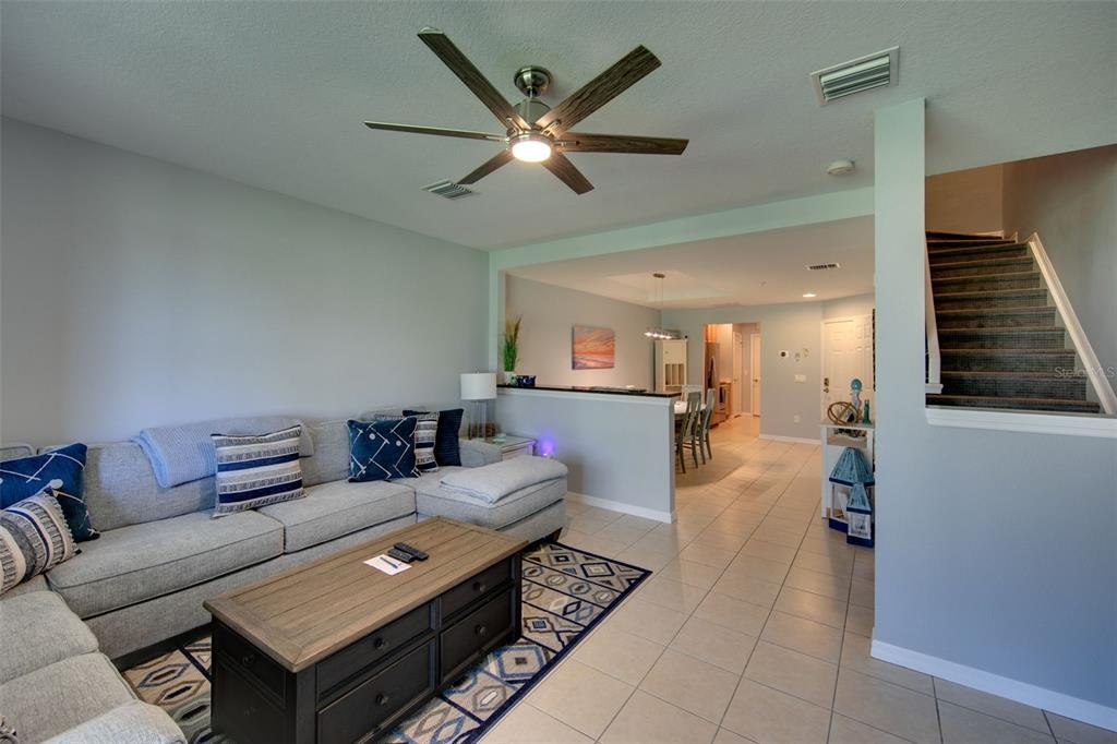 4026 Overture Circle Bradenton, FL 34209 - Photo 7 of 26 a living room with furniture and a ceiling fan
