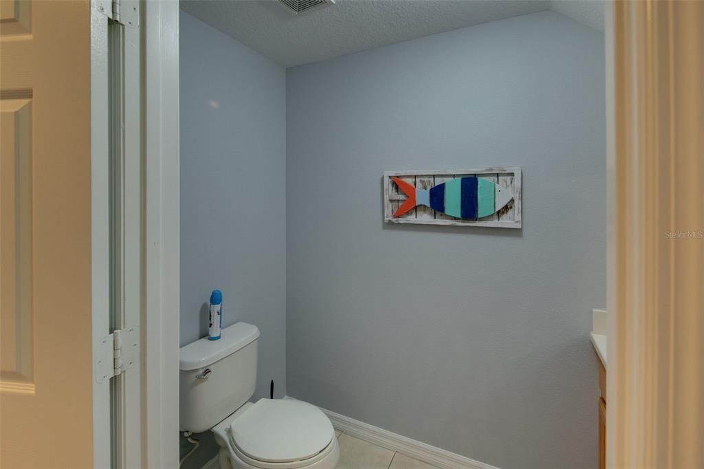 4026 Overture Circle Bradenton, FL 34209 - Photo 8 of 26 a white toilet sitting next to a bathroom sink