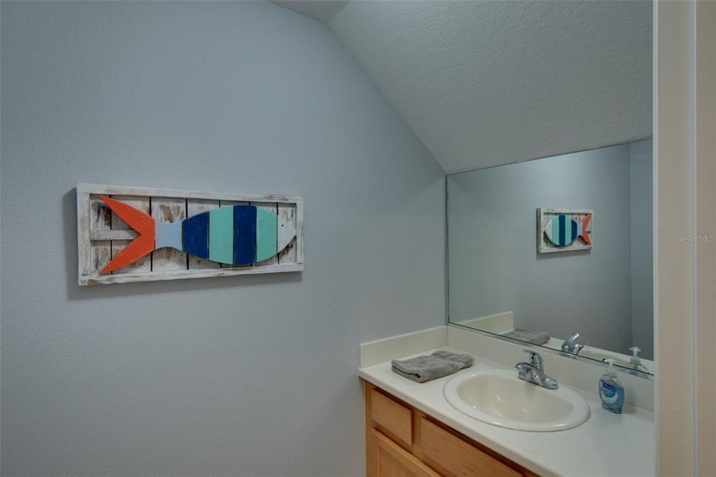 4026 Overture Circle Bradenton, FL 34209 - Photo 9 of 26 a bathroom with a sink and a mirror
