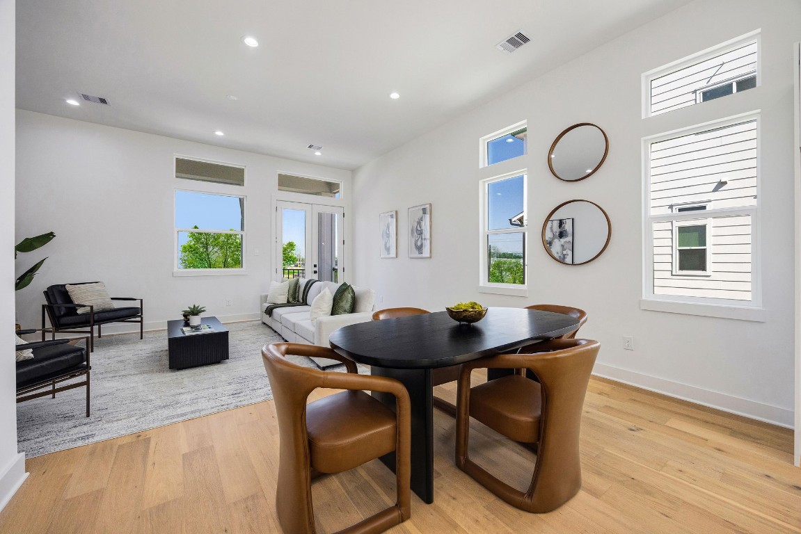 303 Marcella Street, Unit P Houston, TX 77091 - Photo 11 of 26 View of the dining area seamlessly connected to the living room and balcony perfect for entertaining and family gatherings.