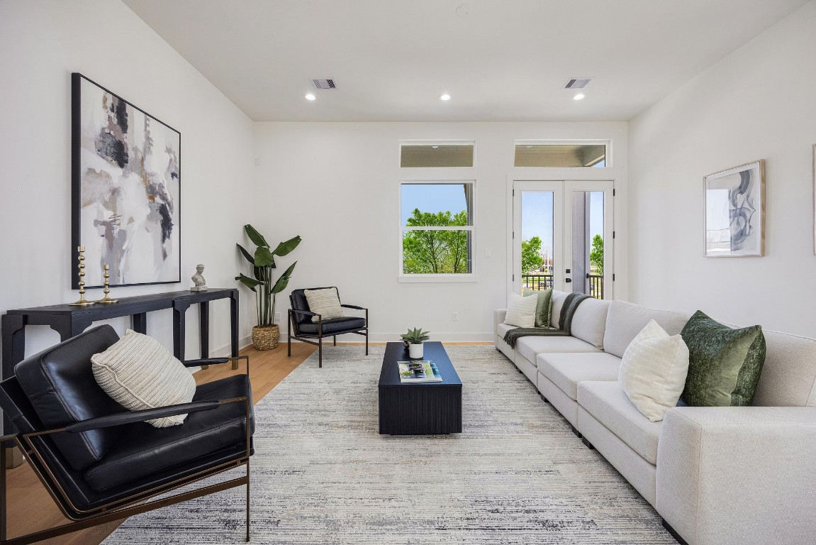 303 Marcella Street, Unit P Houston, TX 77091 - Photo 13 of 26 Spacious living room and balcony located on the second floor