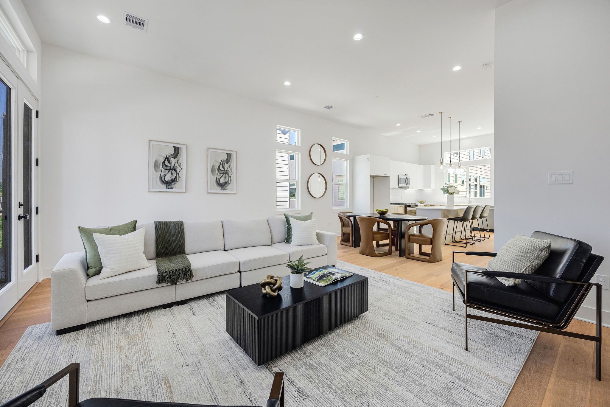 303 Marcella Street, Unit P Houston, TX 77091 - Photo 14 of 26 Another view of the living room open to the dining and kitchen areas.