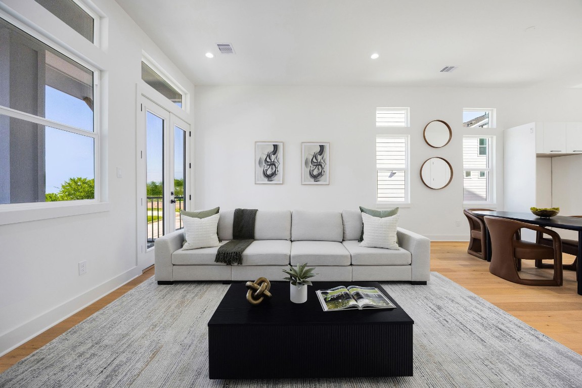 303 Marcella Street, Unit P Houston, TX 77091 - Photo 2 of 26 Elegant open-concept dining and living area with modern finishes and abundant natural light.