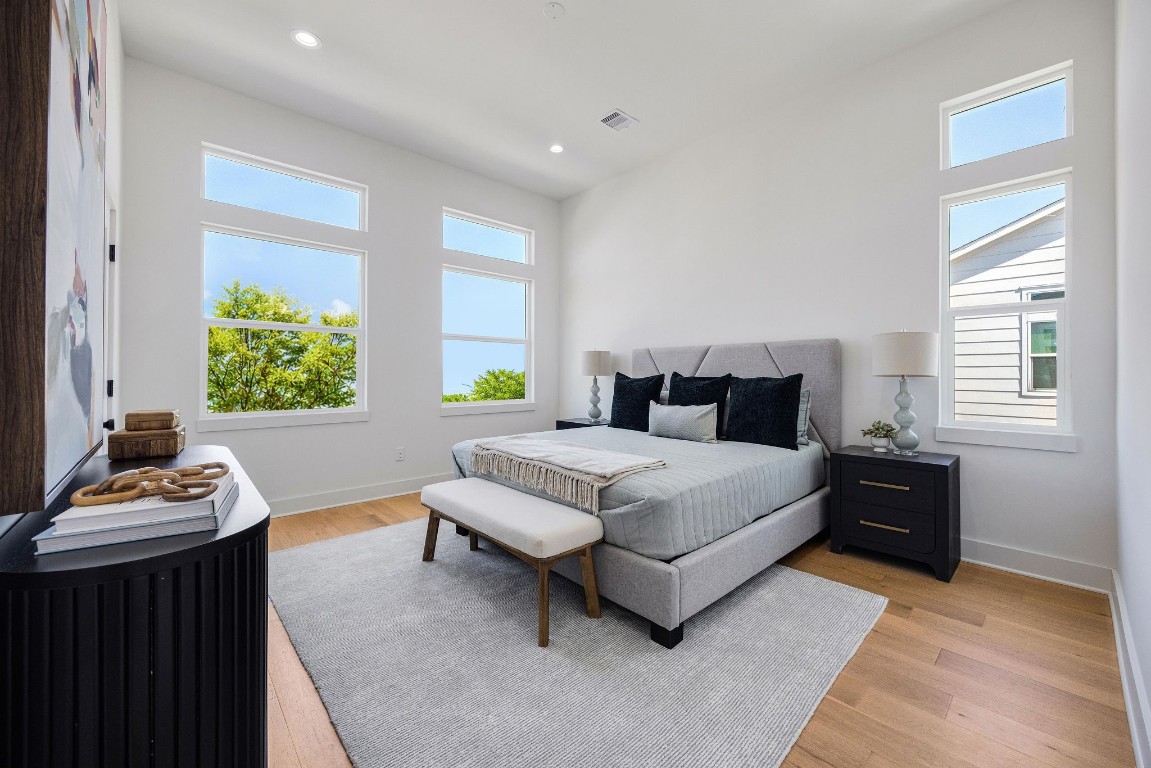 303 Marcella Street, Unit P Houston, TX 77091 - Photo 3 of 26 Spacious primary bedroom flooded with lots of natural light, located on the third floor.