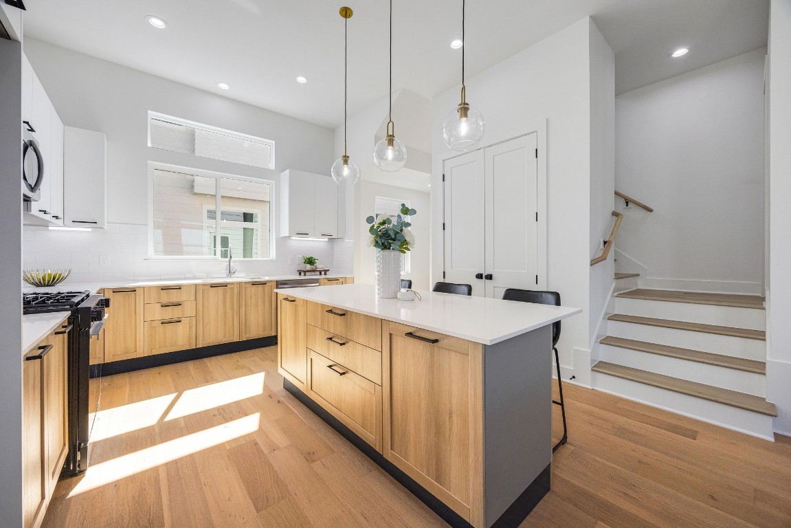 303 Marcella Street, Unit P Houston, TX 77091 - Photo 7 of 26 Spacious kitchen flooded with natural light, modern finishes, and endless storage.