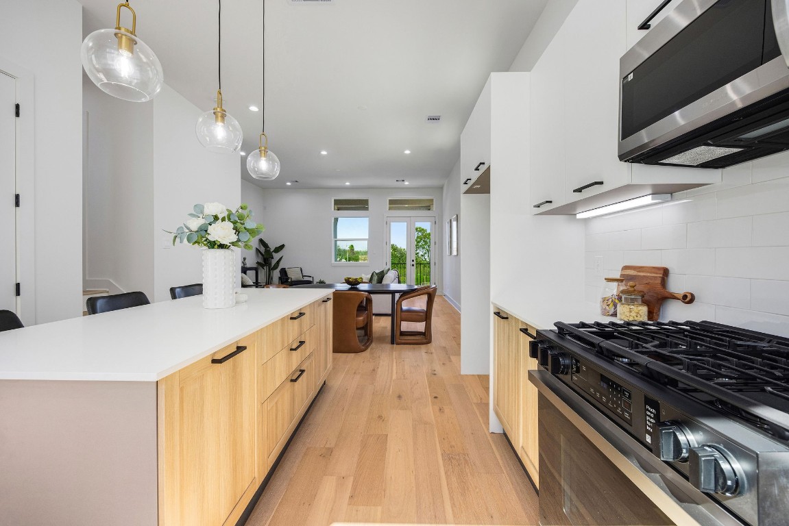 303 Marcella Street, Unit P Houston, TX 77091 - Photo 8 of 26 Another view of the large kitchen, equipped with Samsung stainless steel appliances.