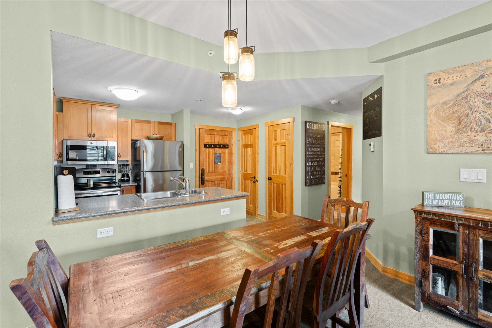 910 Copper Road, Unit 308 Frisco, CO 80443 - Photo 17 of 42 Dining area featuring light colored carpet and baseboards