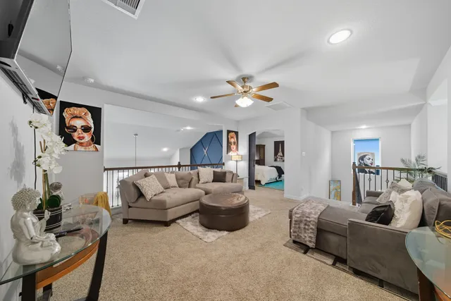 a living room with furniture and a window