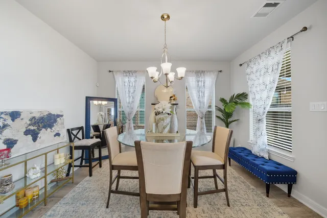 a dining room with furniture and window