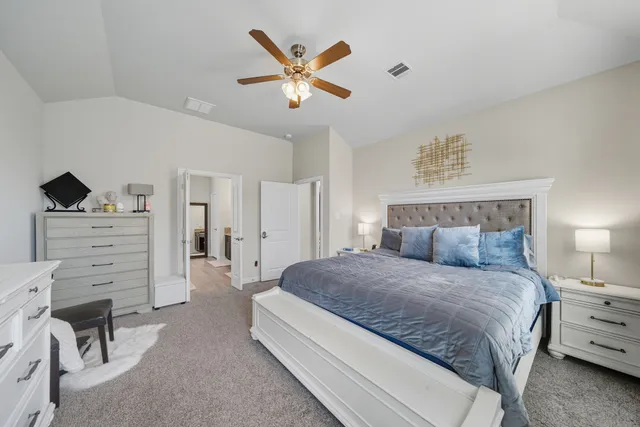 a bedroom with a bed and furniture