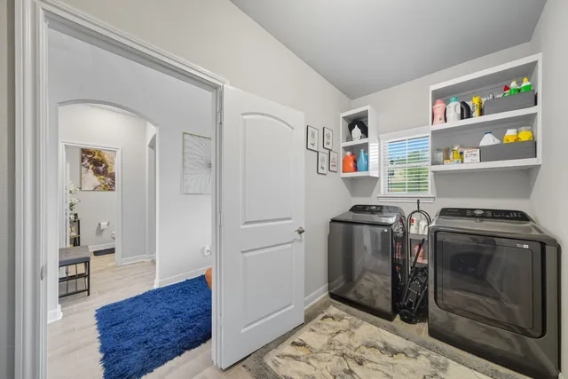 a kitchen with stainless steel appliances granite countertop a stove and a refrigerator