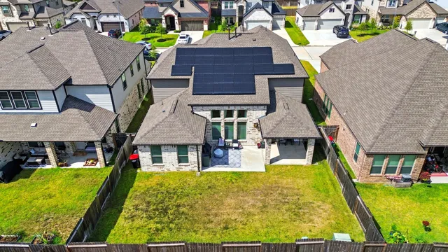 a aerial view of a house with swimming pool