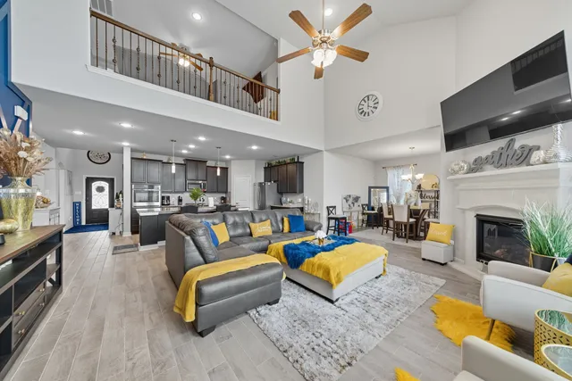 a living room with furniture fireplace and a flat screen tv