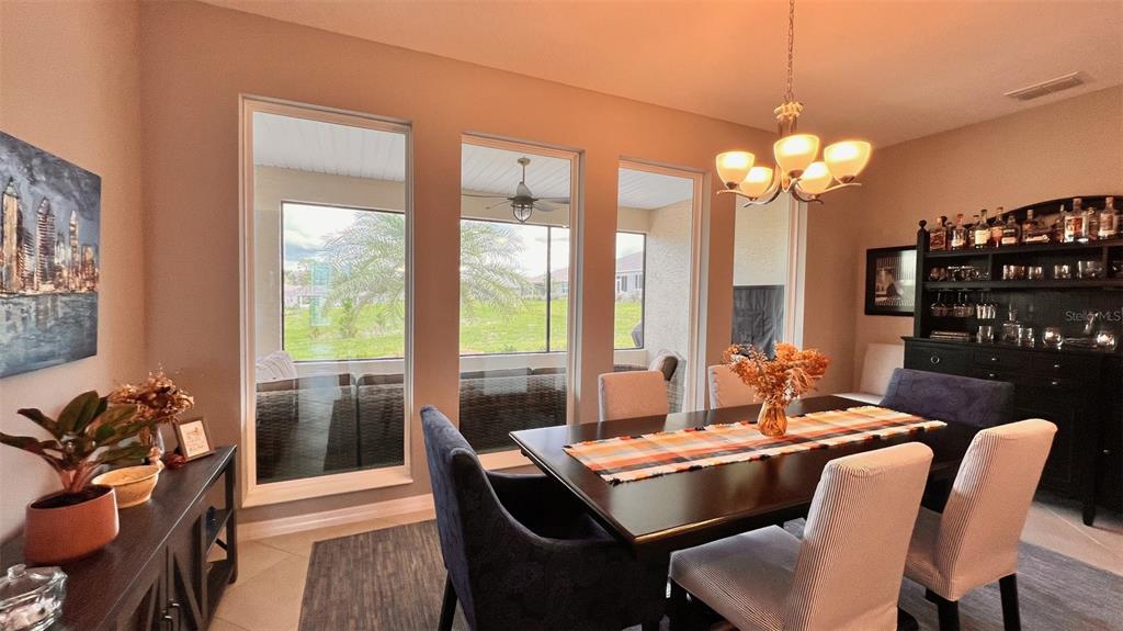 10287 Southwest 96th Lane Ocala, FL 34481 - Photo 18 of 54 a view of a dining room with furniture window and outside view