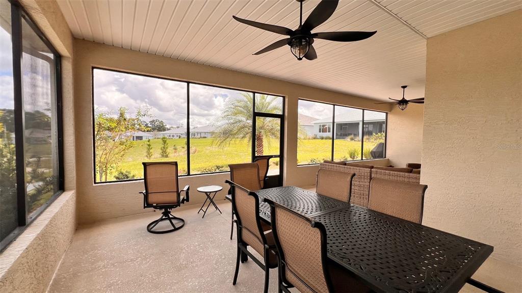 10287 Southwest 96th Lane Ocala, FL 34481 - Photo 37 of 54 a view of a dining room with furniture window and outside view