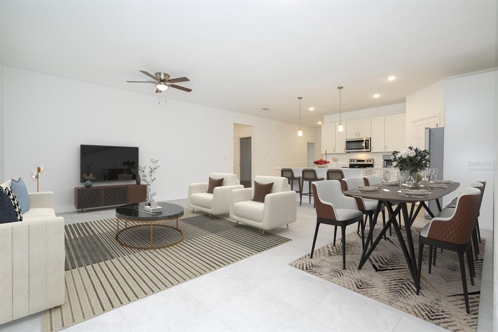 8 Locust Run Ocala, FL 34472 - Photo 24 of 71 a living room with furniture a flat screen tv and a table