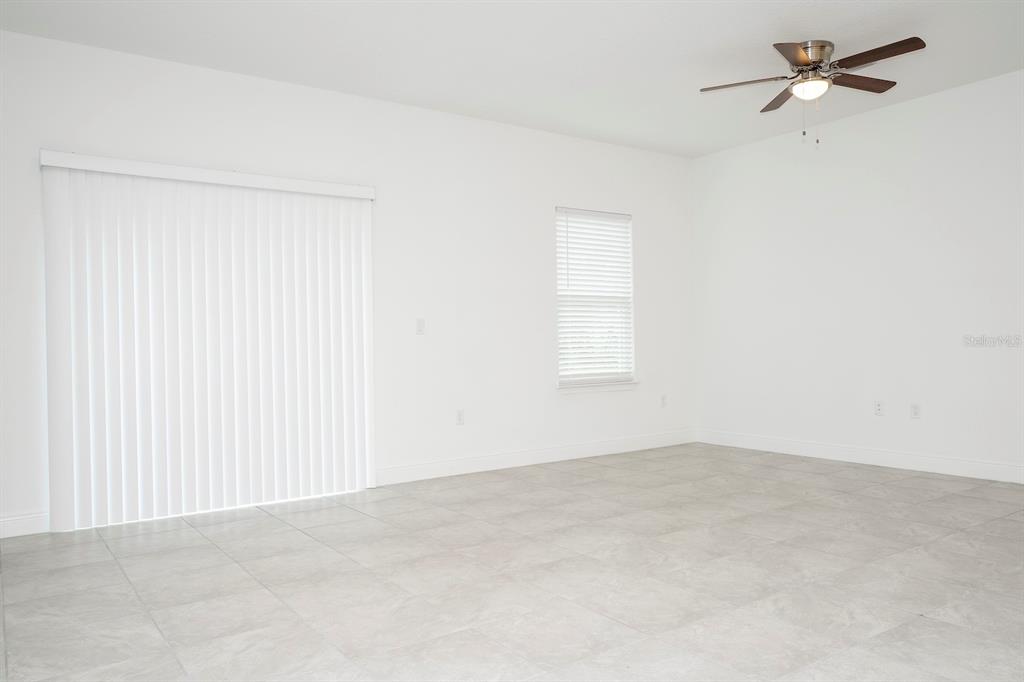 8 Locust Run Ocala, FL 34472 - Photo 29 of 71 an empty room with a window and a fan