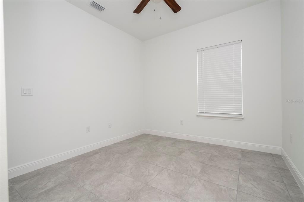 8 Locust Run Ocala, FL 34472 - Photo 48 of 71 an empty room with a window and a fan